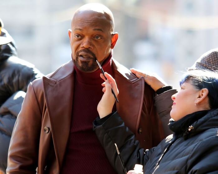 Makeup artists are dyeing Samuel L. Jackson’s beard on the set of Shaft in New York