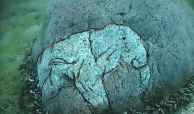 A Rock With A Carving Of A Mastodon At The Underwater Stonehenge Of Lake Michigan