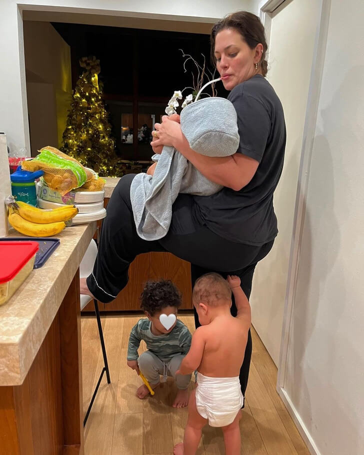 Ashley Graham proves that parenting is literally a balancing act.