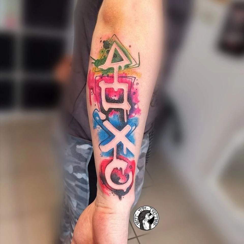 Underarm Water-colored PlayStation Tattoo