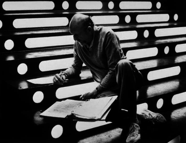 Irvin Kershner consults the screenplay on the carbon-freezing chamber steps.