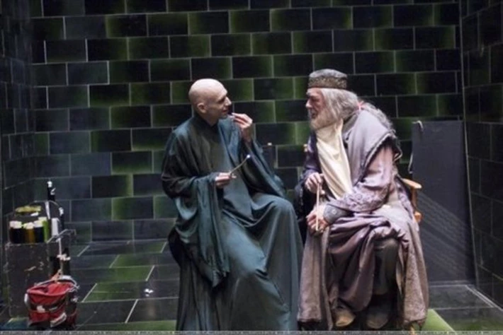 Enemies become friends when the camera isn’t rolling, as Voldemort and Dumbledore share a laugh.