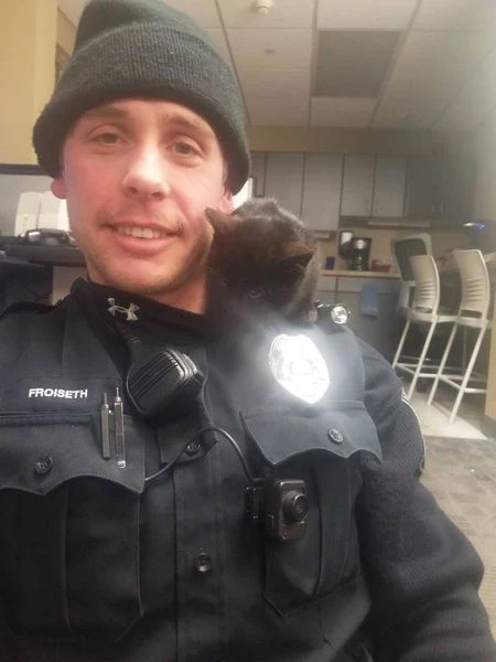 Officer Frosein brought his new furry friend with him to the police station.