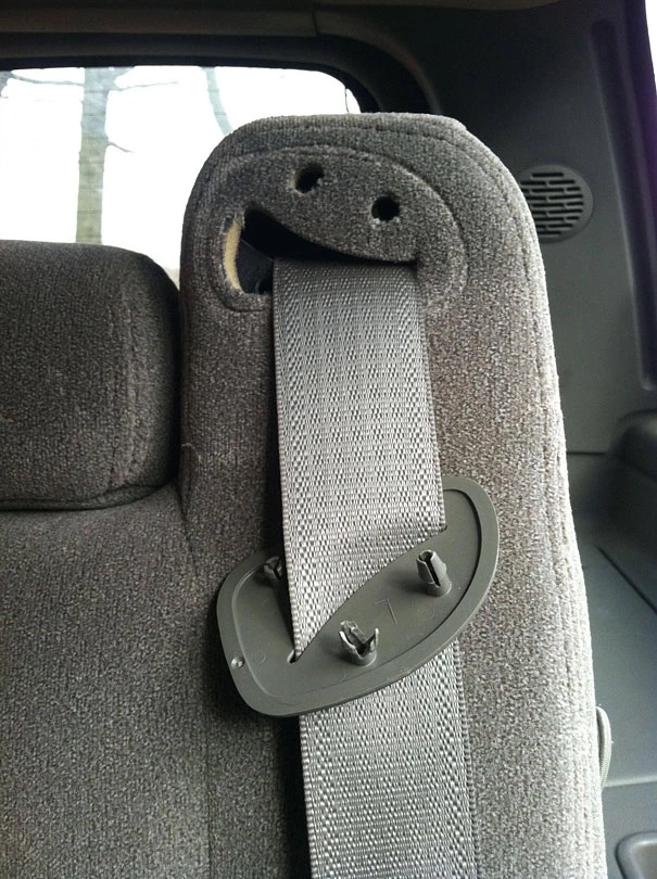 This Broken Seatbelt Holder Looks Like Someone Is Barfing On Another