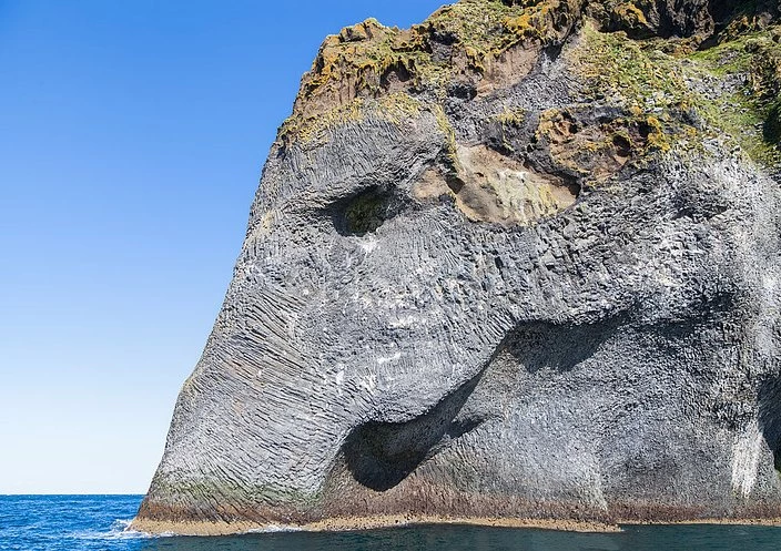 A Cliff That Looks Like An Elephant Drinking Water